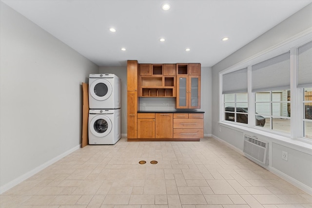 4206 Law St, Houston, TX 77005 - laundry room with stacked washer and clothes dryer, recessed lighting, and an AC wall unit