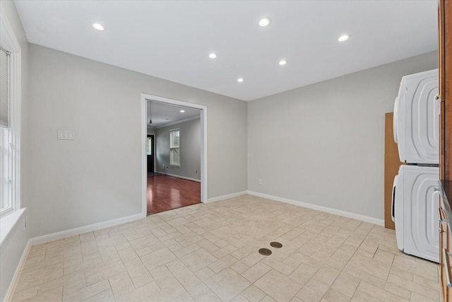 4206 Law St, Houston, TX 77005 - spare room with stacked washer and clothes dryer and recessed lighting