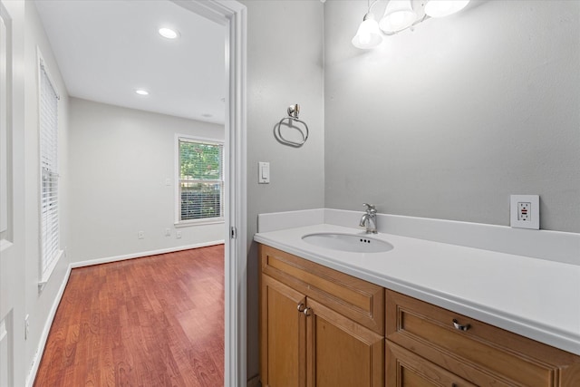 4206 Law St, Houston, TX 77005 - bathroom with wood finished floors, vanity, and recessed lighting