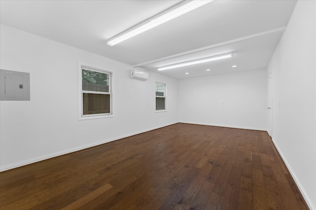 4206 Law St, Houston, TX 77005 - spare room featuring a wall mounted air conditioner, electric panel, and hardwood / wood-style floors