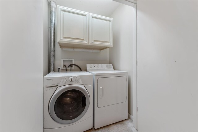 4206 Law St, Houston, TX 77005 - washroom with washing machine and clothes dryer and cabinet space