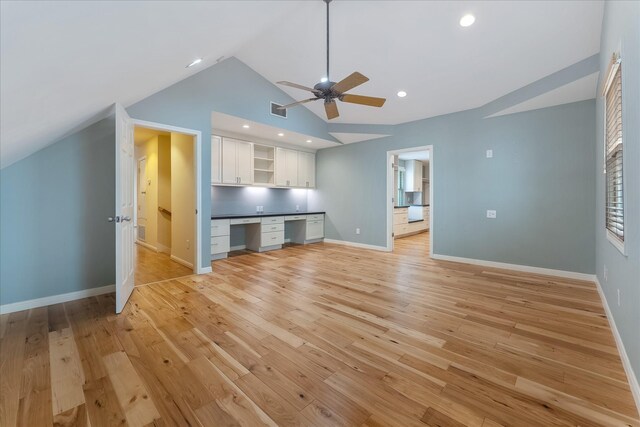 4206 Law St, Houston, TX 77005 - unfurnished living room featuring built in desk, ceiling fan, vaulted ceiling, light wood-style floors, and recessed lighting