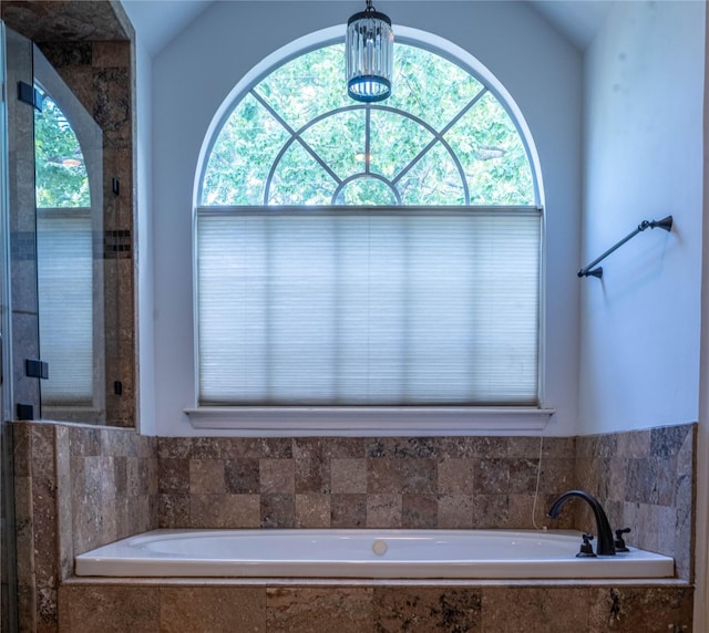 5563 Beverlyhill St, Houston, TX 77056 - full bathroom with lofted ceiling, a bath, and a stall shower