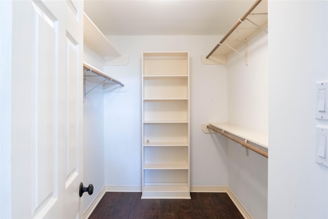 5563 Beverlyhill St, Houston, TX 77056 - spacious closet featuring dark wood-type flooring
