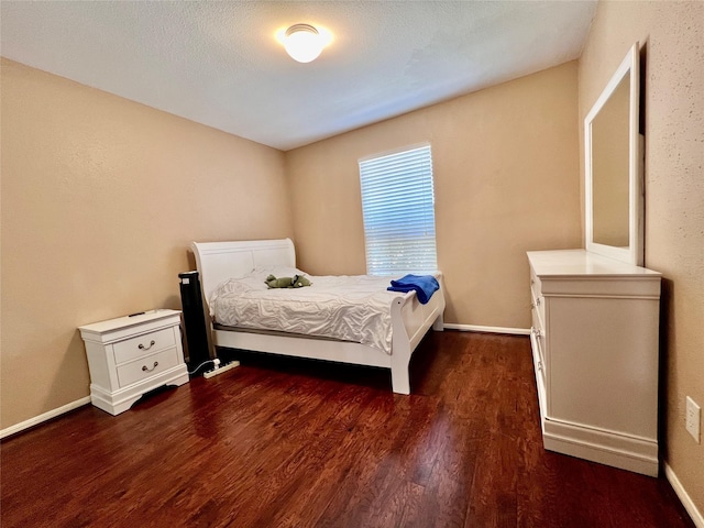 18738 Shannon Glen Ln, Houston, TX 77084 - bedroom with dark wood-style floors and baseboards