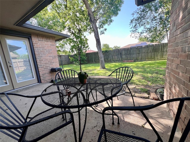 18738 Shannon Glen Ln, Houston, TX 77084 - fenced backyard with outdoor dining area and a patio