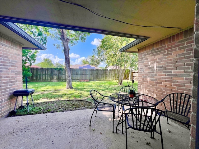 18738 Shannon Glen Ln, Houston, TX 77084 - fenced backyard featuring a patio area, outdoor dining area, and grilling area