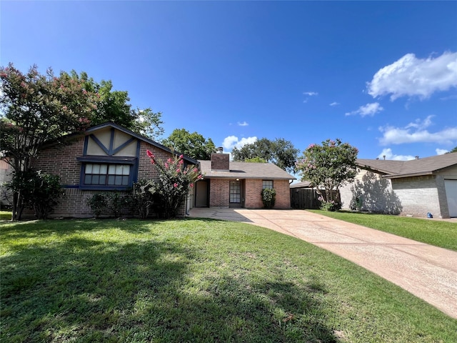 18738 Shannon Glen Ln, Houston, TX 77084 - view of front of home with brick siding, a chimney, and driveway