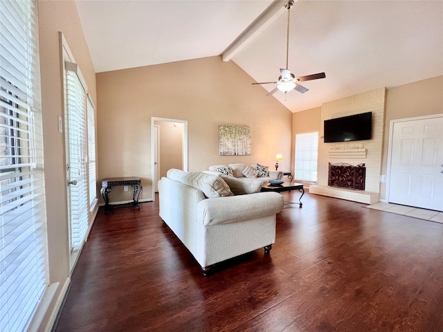 18738 Shannon Glen Ln, Houston, TX 77084 - living room with high vaulted ceiling, a ceiling fan, beam ceiling, a fireplace, and dark wood finished floors
