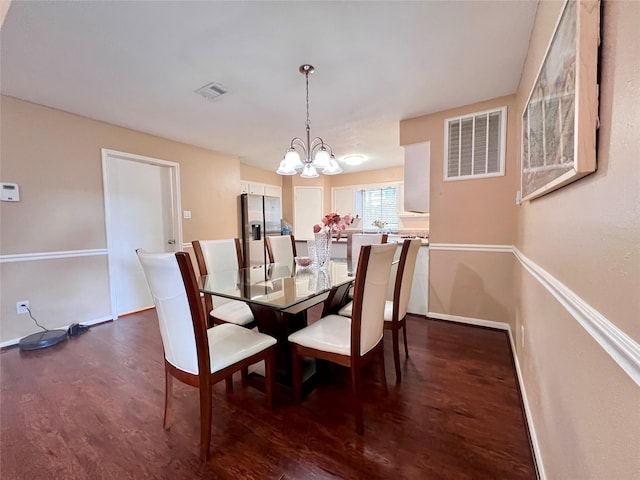 18738 Shannon Glen Ln, Houston, TX 77084 - dining space featuring a chandelier and dark wood-style floors