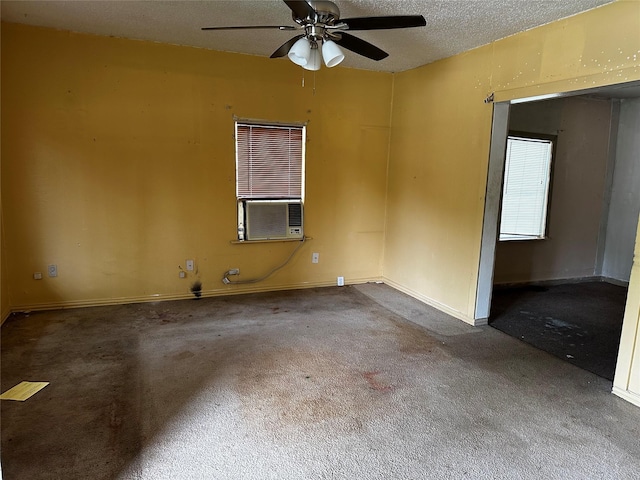 213 W Lobit St, Baytown, TX 77520 - spare room featuring carpet flooring, a ceiling fan, a textured ceiling, and cooling unit