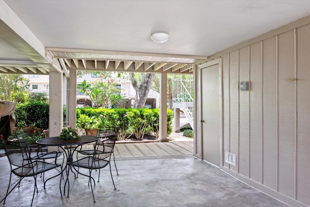 33 Lakewood Ln, Seabrook, TX 77586 - view of patio / terrace featuring outdoor dining space and stairs