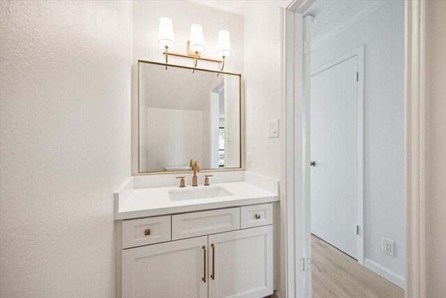 33 Lakewood Ln, Seabrook, TX 77586 - bathroom featuring wood finished floors and vanity