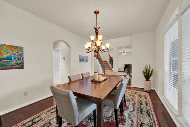 28006 Everett Knolls Dr, Katy, TX 77494 - dining room with arched walkways, a chandelier, wood finished floors, and ceiling fan