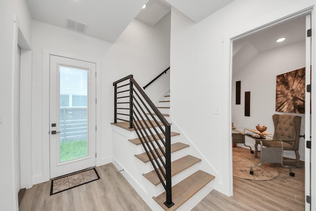 3602 Runnels St, Houston, TX 77003 - foyer entrance featuring light wood-type flooring, stairway, and recessed lighting
