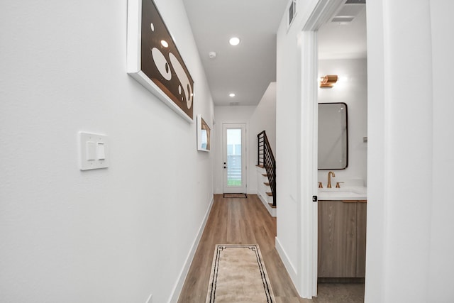 3602 Runnels St, Houston, TX 77003 - hallway featuring wood finished floors, recessed lighting, and stairway