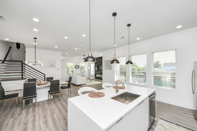 3602 Runnels St, Houston, TX 77003 - kitchen featuring light wood-style floors, recessed lighting, hanging light fixtures, modern cabinets, and light countertops