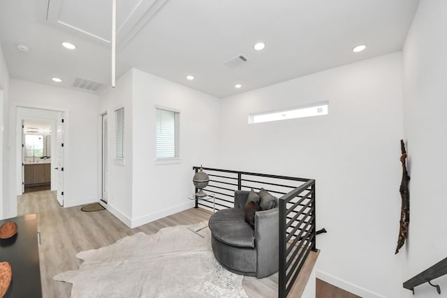 3602 Runnels St, Houston, TX 77003 - living area featuring wood finished floors, recessed lighting, and an upstairs landing