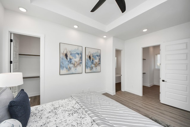 3602 Runnels St, Houston, TX 77003 - bedroom with wood finished floors, recessed lighting, a closet, a tray ceiling, and a spacious closet