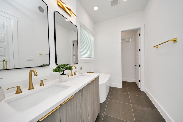 3602 Runnels St, Houston, TX 77003 - full bathroom featuring double vanity, a freestanding bath, and tile patterned floors