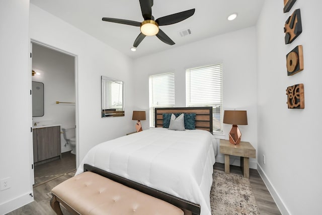 3602 Runnels St, Houston, TX 77003 - bedroom with wood finished floors, ensuite bath, and ceiling fan