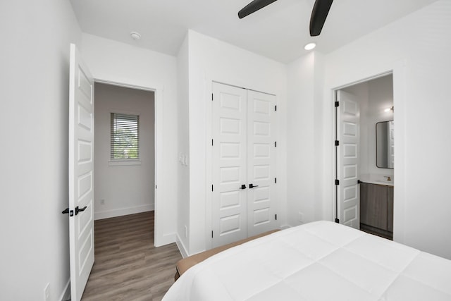 3602 Runnels St, Houston, TX 77003 - bedroom with wood finished floors, a closet, connected bathroom, and a ceiling fan