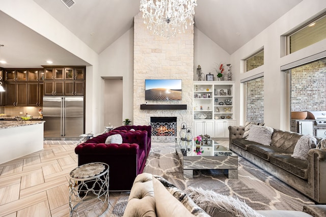 17023 Sweet Bay Ct, Conroe, TX 77385 - living room featuring high vaulted ceiling, a chandelier, and a fireplace