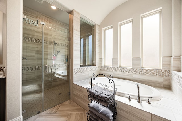 17023 Sweet Bay Ct, Conroe, TX 77385 - full bathroom featuring a bath, a stall shower, and lofted ceiling
