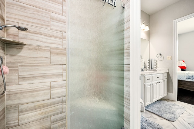 17023 Sweet Bay Ct, Conroe, TX 77385 - bathroom with tiled shower, vanity, and ensuite bathroom