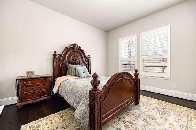 17023 Sweet Bay Ct, Conroe, TX 77385 - bedroom with baseboards and wood finished floors