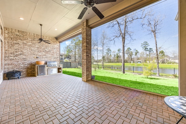 17023 Sweet Bay Ct, Conroe, TX 77385 - fenced backyard featuring a ceiling fan, area for grilling, a water view, and a patio area
