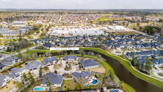 17023 Sweet Bay Ct, Conroe, TX 77385 - aerial view of property and surrounding area featuring a large body of water and nearby suburban area