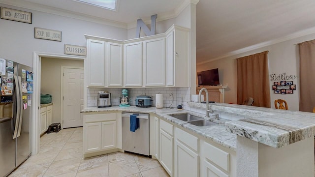 7475 Wooded Creek Dr, Beaumont, TX 77708 - kitchen with appliances with stainless steel finishes, crown molding, a peninsula, backsplash, and light stone countertops