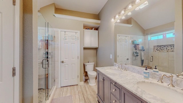 7475 Wooded Creek Dr, Beaumont, TX 77708 - bathroom with double vanity, a shower stall, and vaulted ceiling