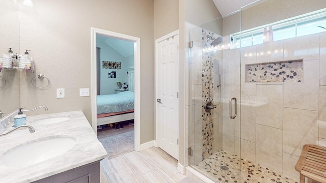 7475 Wooded Creek Dr, Beaumont, TX 77708 - bathroom with lofted ceiling, a shower stall, ensuite bath, and double vanity