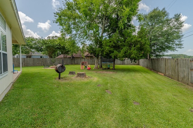 7475 Wooded Creek Dr, Beaumont, TX 77708 - fenced backyard with a trampoline