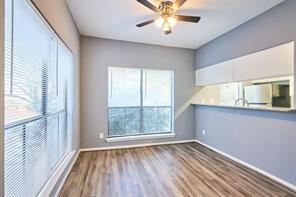 3724 Woodchase Dr, Houston, TX 77042 - spare room with wood finished floors and a ceiling fan
