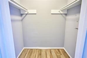 3724 Woodchase Dr, Houston, TX 77042 - walk in closet with wood finished floors