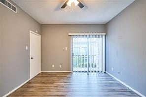3724 Woodchase Dr, Houston, TX 77042 - empty room with ceiling fan and wood finished floors