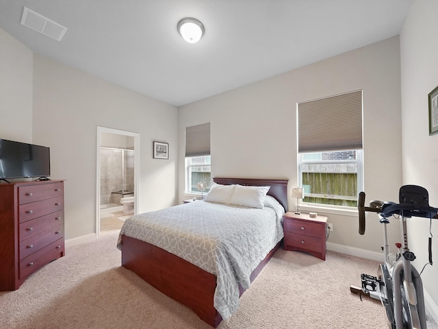 4202 Lodge Ranch Ct, Fulshear, TX 77441 - carpeted bedroom with baseboards and ensuite bathroom