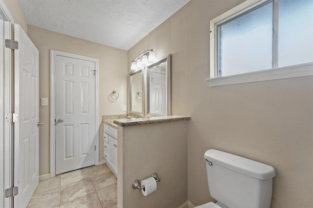 9602 Philmont Dr, Houston, TX 77080 - bathroom featuring vanity and a textured ceiling