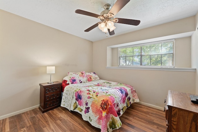 9602 Philmont Dr, Houston, TX 77080 - bedroom with wood finished floors and a ceiling fan
