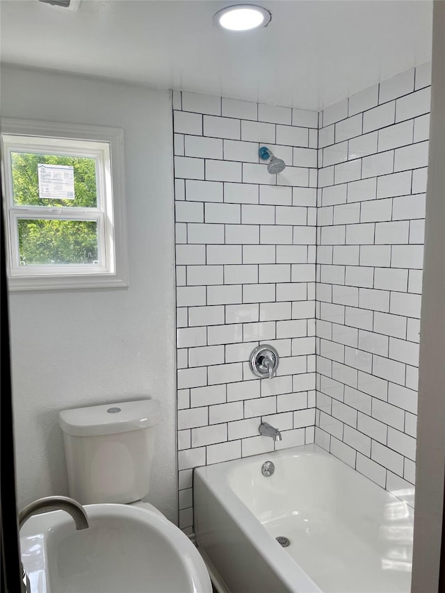 717 W Brazos St, Freeport, TX 77541 - bathroom featuring bathtub / shower combination and toilet