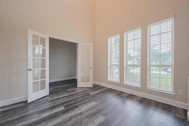 14538 Bending Maple Dr, Houston, TX 77069 - empty room featuring french doors, dark wood-type flooring, and a high ceiling