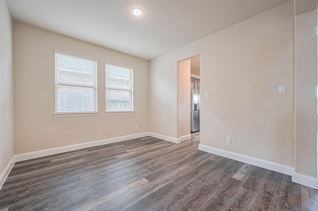 14538 Bending Maple Dr, Houston, TX 77069 - spare room with dark wood-style floors and baseboards