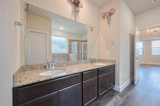 14538 Bending Maple Dr, Houston, TX 77069 - full bathroom featuring a shower stall, wood finished floors, and double vanity