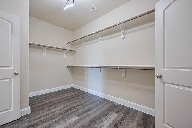 14538 Bending Maple Dr, Houston, TX 77069 - spacious closet featuring dark wood-style flooring