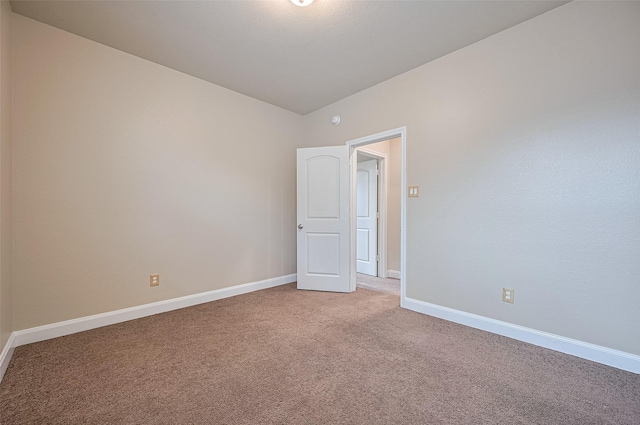 14538 Bending Maple Dr, Houston, TX 77069 - spare room featuring light colored carpet and vaulted ceiling