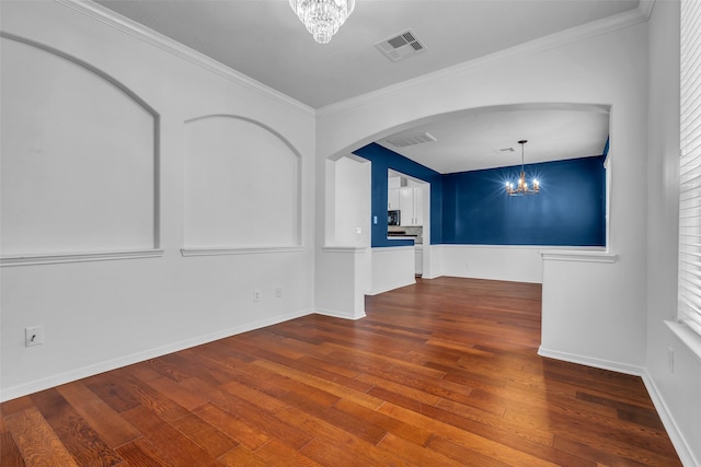7402 Hollister Rdg, Houston, TX 77040 - unfurnished room featuring a chandelier, hardwood / wood-style floors, arched walkways, and crown molding