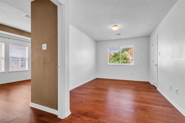 7402 Hollister Rdg, Houston, TX 77040 - spare room with hardwood / wood-style flooring and a textured ceiling